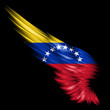 Abstract wing with Venezuela flag on black background