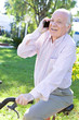 Elder man making a call