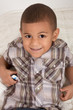 Photo: Young little boy in checkered shirt and jeans Young little boy in checkered shirt and jeans