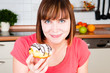 young woman enjoying a doughnut young woman enjoying a doughnut