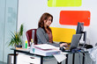 Young woman working at computer in office