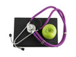 Stethoscope on the black medical  book isolated on white