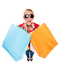 Attractive Young Woman in Sunglasses Smiling with Shopping