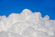 Puffy clouds and blue sky