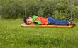 Child sleeping on a swing