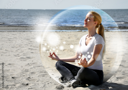 Photo: Woman Meditating on Beach in Peace Woman Meditating on Beach in Peace