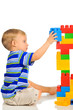 Cute little boy is playing with building blocks Cute little boy is playing with building blocks