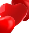 close up of bright red hearts on white background
