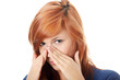 Young woman with sinus pressure pain