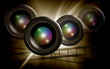 lens & film strip on abstract dark background lens & film strip on abstract dark background