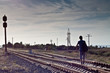 Teen boy with problems walking on rail road Teen boy with problems walking on rail road