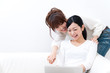 two beautiful asian women relaxing on the sofa two beautiful asian women relaxing on the sofa