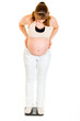 Photo: Interested pregnant woman standing on weight scale Interested pregnant woman standing on weight scale