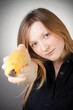 Image of girl holds banana as a gun Image of girl holds banana as a gun