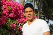 man standing in front of Bougainvillea flowers