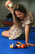Girl having fun on pool table