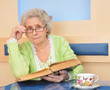 senior lady holding a book