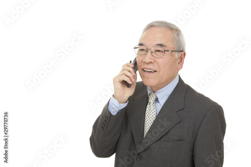 Photo: old Japanese male businessman talk mobile phone old Japanese male businessman talk mobile phone