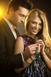 Happy young man gifting a ring to a beautiful young woman