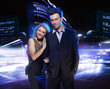 Young couple over the night city background
