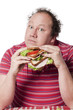 homme obèse expressif et sandwich varié