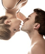 Conceptual portrait of a young couple gentle kissing