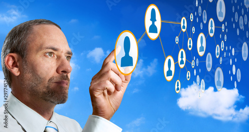 Photo: Businessman works with social network Businessman works with social network