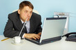 a very busy man working with laptop a very busy man working with laptop