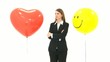 Woman standing between two balloons