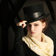 Classic fashion model with black hat saluting Classic fashion model with black hat saluting