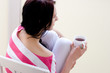 Caucasian young woman with cup of tea Caucasian young woman with cup of tea