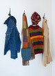 Colorful clothing on coat hooks Colorful clothing on coat hooks