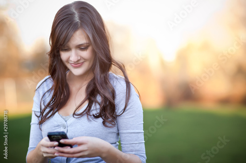 Photo: Woman texting Woman texting