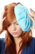 Woman with ice bag for headaches