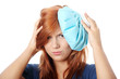 Woman with ice bag for headaches