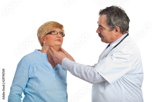 Photo: Mature endocrinologist with patient woman Mature endocrinologist with patient woman