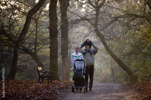 Photo: A family walking in the park A family walking in the park