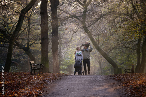 Photo: A family walking in the park A family walking in the park