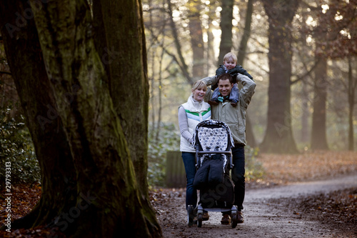 Photo: A family walking in the park A family walking in the park
