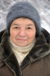 Portrait of an old woman in winter