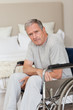 Thoughtful senior man in his wheelchair