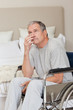 Thoughtful senior man in his wheelchair
