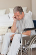 Thoughtful senior man in his wheelchair