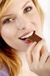 young beautiful woman with a bar of chocolate
