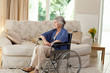 Retired woman in her wheelchair Retired woman in her wheelchair