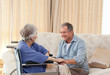 Senior couple talking in the living room at home Senior couple talking in the living room at home
