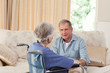 Senior couple talking in the living room at home Senior couple talking in the living room at home