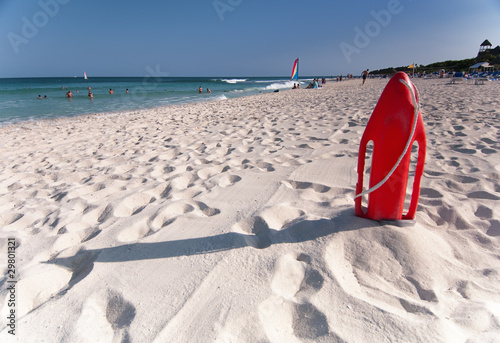 Photo: Red lifesavers board on Playa Del Secreto beach. Red lifesavers board on Playa Del Secreto beach.