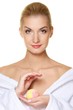 Beautiful young woman with aroma bath ball