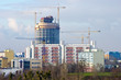Big building under construction with few cranes